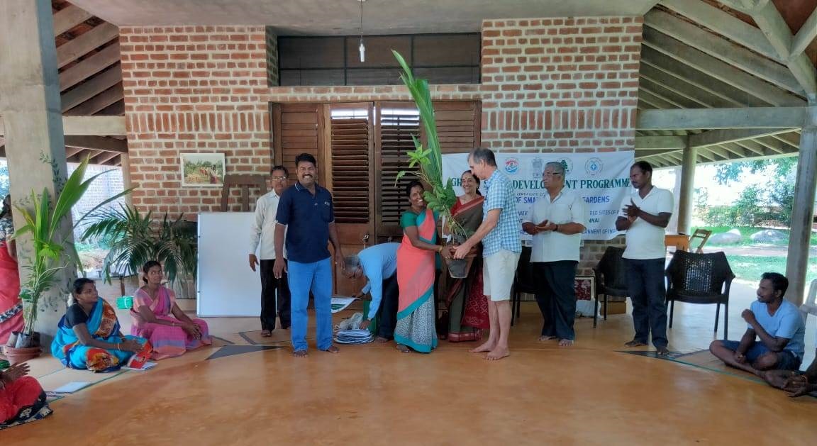 Mr. Paul Blanchflower, Director, Auroville Botanical Garden distributing saplings and gardening tool